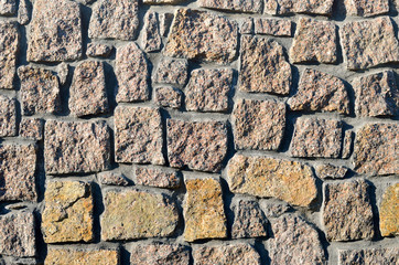 Texture of a wall built of granite stones