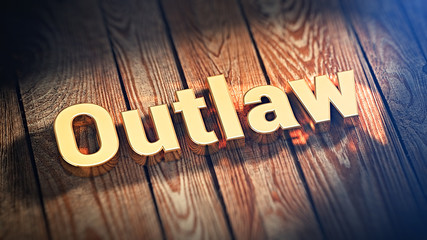 Word Outlaw on wood planks