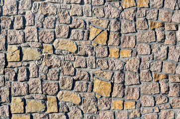 Texture of a wall built of granite stones