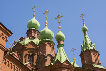 Fototapeta na wymiar Orthodox Church with domes and crosses