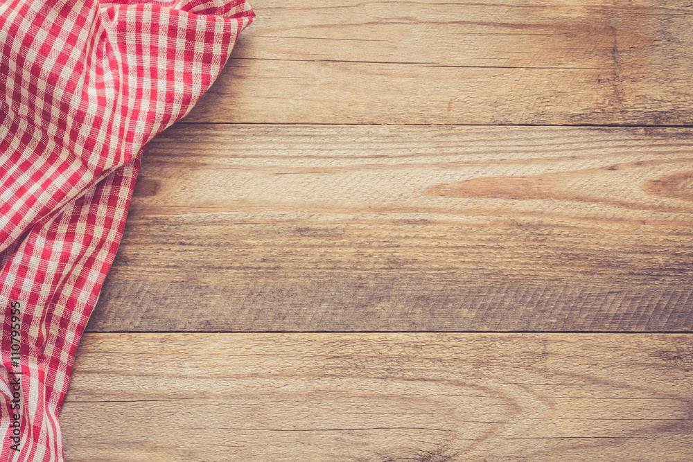 Wall mural Wooden background with textile / Cooking food / pizza wooden table background with red and white textile. Copy space for text