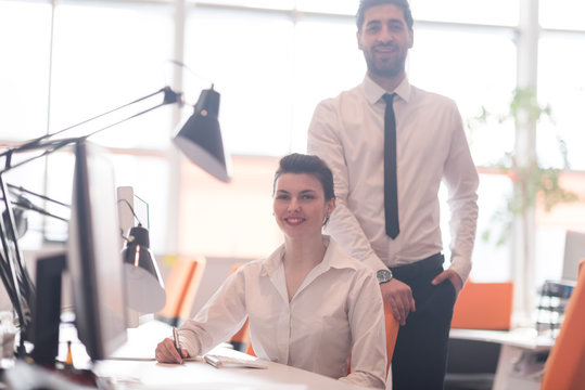 portrait of business couple at office