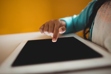 Close up of girl using a tablet