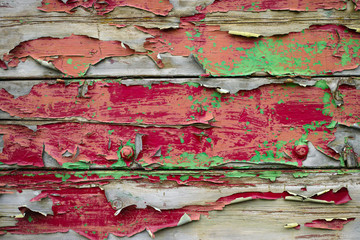Old paint layer on textured wooden planks