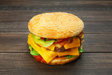 Meet and cheese burger at rustic wood