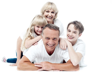 Sweet family having fun on the floor .