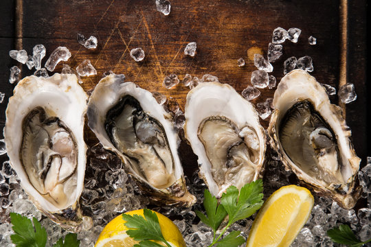 Fresh oysters on a black stone
