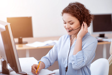 Cheerful woman talking working in the call center