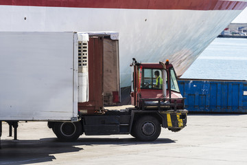 Truck moving a container