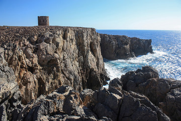 Fototapeta na wymiar The tower of Cala Domestica in Sardinia