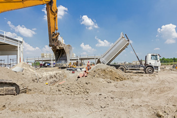 Excavator is working on construction site. Caterpillar in action
