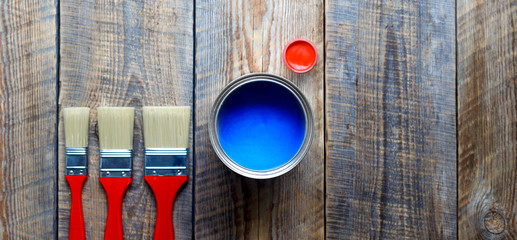 preparation for painting wooden floor at home with blue paint