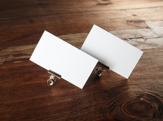 Blank business cards. Photo of blank white business cards on vintage wooden background. Mockup for...