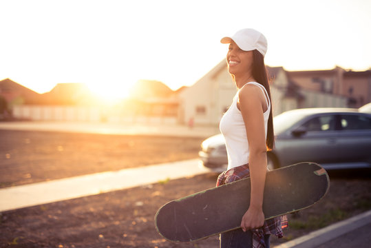 Woman carring skateboard