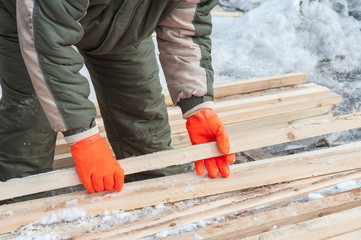 Carpenter working at sawmill 