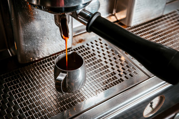 Fototapeta na wymiar Professional coffee machine makes coffee