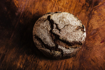 Naklejka premium Bread cereals on a wooden table
