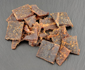 Beef Jerky On Slate Stone Background
