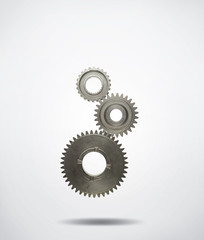 Three metal cog gears
