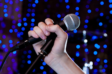 Microphone in hand singer on stage