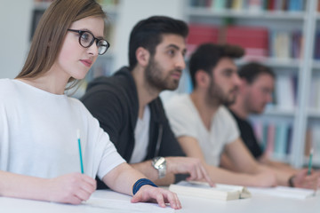 group of students study together in classroom