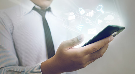 Concept of Smartphone - Asian Businessman Using High Tech Smartp