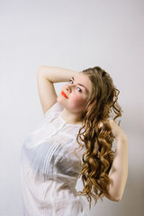 emotionless young woman posing on a white background