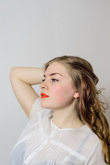 emotionless young woman posing on a white background