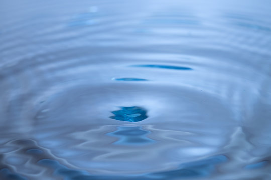 Abstract blue circle water drop ripple. Liquid texture backgroun