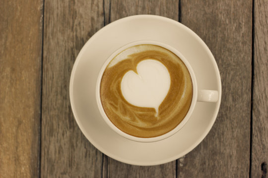 Cup of hot latte art coffee.