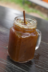 Iced Americano on wood table.