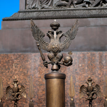 The double-headed eagle on the fence of the Alexander Column in front of the Winter Palace. Russia. Petersburg.