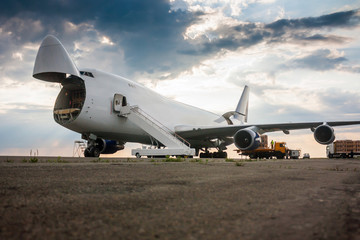 Unloading wide body cargo airplane
