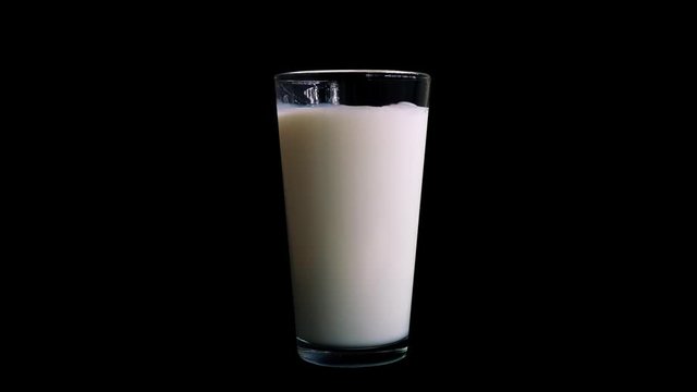 Milk Pours Into Glass
