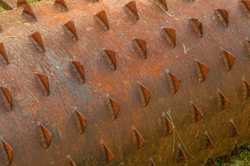 rusty iron cylinder with sharp points