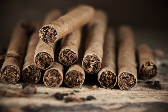 Cigars pile on wood