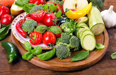 Fresh vegetables on a wooden board.