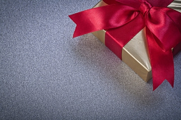 Packed present box on grey background holidays concept