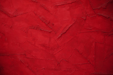 Fototapeta premium red wall background with decorative plaster place for text