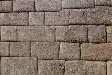 Detail of perfect Inca stonework of Temple of the Sun at Machu Picchu ruins, Peru