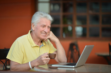 senior man with laptop