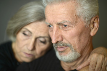 Mature couple near wall