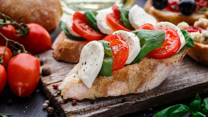 Bruschetta with tomatoes, mozzarella and basil