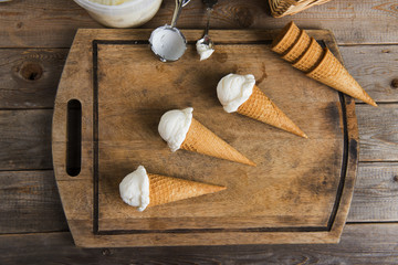 Fototapeta na wymiar creamy vanilla ice cream in preparation with rustic background a