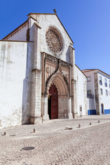 Fototapeta na wymiar Santo Agostinho da Graca church, showing the largest Rose Window carved of a single slab of stone in Portugal. 14th and 15th century Mendicant and Flamboyant Gothic Architecture. Santarem, Portugal.