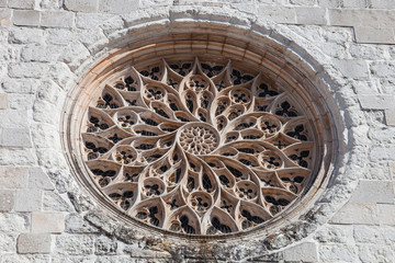 The Rose Window of Santo Agostinho da Graca church is the largest carved of a single stone slab in Portugal. 14th and 15th century Mendicant and Flamboyant Gothic Architecture. Santarem, Portugal.