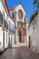 Fototapeta na wymiar Santo Agostinho da Graca church, seen from one of the old streets of Santarem. 14th and 15th century Mendicant and Flamboyant Gothic Architecture. Santarem, Portugal.