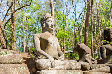 Fototapeta na wymiar Sculpture of Stone Buddha in Wat U-mong (U-mong temple), an anci