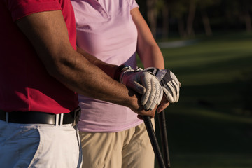 portrait of couple on golf course