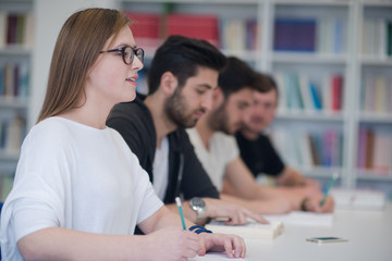 group of students study together in classroom